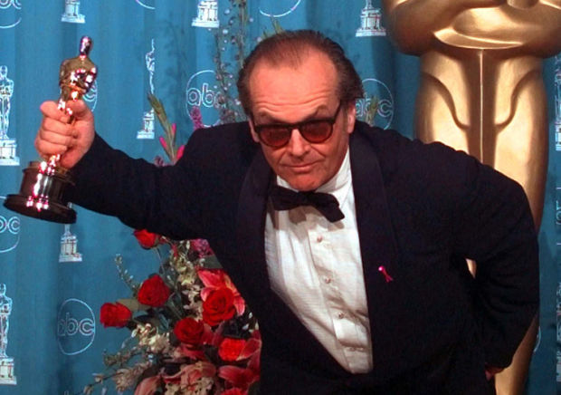 Jack Nicholson gestures with his Oscar for Best Actor at the 70th annual Academy Awards at the Shrine Auditorium in Los Angeles, Monday, March 23, 1998. Nicholson won for his role in 'As Good As It Gets.' (AP Photo/Mark J. Terrill)